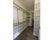Spacious walk-in closet with metal shelving, providing ample storage and organization for any wardrobe at 222 S Caldwell St # 1801, Charlotte, NC 28202