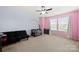 This colorful bedroom features two windows and soft carpet at 2262 Galloway Sw Ln, Concord, NC 28025