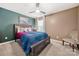Comfortable bedroom featuring neutral carpet, a large window, and a ceiling fan at 2262 Galloway Sw Ln, Concord, NC 28025