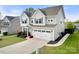 Beautiful two-story home with a two-car garage, a well-maintained lawn, and a classic design at 2262 Galloway Sw Ln, Concord, NC 28025
