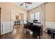 Bright home office with hardwood floors, neutral walls, and a comfortable workspace at 2262 Galloway Sw Ln, Concord, NC 28025