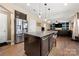 Open-concept kitchen boasts stainless steel appliances, a central island, and seamless flow into living areas at 2262 Galloway Sw Ln, Concord, NC 28025