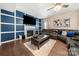 Cozy living room with a fireplace, large television, comfortable seating, and stylish decor at 2262 Galloway Sw Ln, Concord, NC 28025
