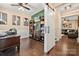 Open-concept living area with stylish decor, hardwood floors, and an attached office at 2262 Galloway Sw Ln, Concord, NC 28025