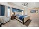 This expansive primary suite features a king bed, bedside tables, sitting area, and neutral decor at 2262 Galloway Sw Ln, Concord, NC 28025