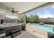 Outdoor pool and hot tub area with covered patio, ceiling fan, and lounge seating at 2262 Galloway Sw Ln, Concord, NC 28025