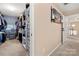 Large walk-in closet with hanging clothes, shelving, and lots of storage space at 2262 Galloway Sw Ln, Concord, NC 28025