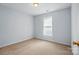 Cozy bedroom with neutral walls, carpet, and natural light from the window at 2290 Kestrel Dr, Rock Hill, SC 29732
