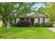 A single-story home with a manicured front lawn, mature tree, and charming curb appeal at 2290 Kestrel Dr, Rock Hill, SC 29732