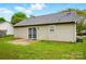 This home has a side patio, vinyl siding, a gray roof, and a sliding glass door that leads inside at 2290 Kestrel Dr, Rock Hill, SC 29732