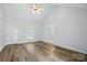 Bright living room featuring wood floors, neutral walls, vaulted ceiling, and natural light at 2290 Kestrel Dr, Rock Hill, SC 29732