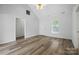 Spacious living room with vaulted ceiling, light-toned wood floors, and white walls for a modern feel at 2290 Kestrel Dr, Rock Hill, SC 29732