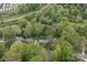 Overhead view of a neighborhood surrounded by mature trees, offering a sense of community and natural beauty at 2815 Burnt Mill Rd, Charlotte, NC 28210