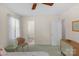 Bedroom with two windows featuring a ceiling fan and closet access at 2815 Burnt Mill Rd, Charlotte, NC 28210