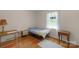 Bedroom with hardwood floors, single bed and neutral decor at 2815 Burnt Mill Rd, Charlotte, NC 28210