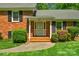Close-up of front porch with painted white trim, brick stairs, and inviting details at 2815 Burnt Mill Rd, Charlotte, NC 28210