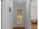 Hallway featuring hardwood floors and a door with glass panes for added elegance at 2815 Burnt Mill Rd, Charlotte, NC 28210