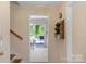 Entryway with staircase, ceramic tile floor, and view into screened porch at 2815 Burnt Mill Rd, Charlotte, NC 28210