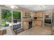 Kitchen with light wood cabinets, and sliding glass doors to the deck and back yard at 2815 Burnt Mill Rd, Charlotte, NC 28210