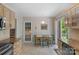 Charming kitchen with light wood cabinets and a cozy breakfast nook by the sliding doors at 2815 Burnt Mill Rd, Charlotte, NC 28210
