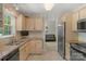 Well-lit kitchen with granite countertops, stainless steel appliances, and tiled backsplash at 2815 Burnt Mill Rd, Charlotte, NC 28210