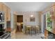 Inviting kitchen with dining area, stairs, and natural light from sliding glass doors to the outside at 2815 Burnt Mill Rd, Charlotte, NC 28210