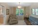 Cozy living room featuring neutral decor, a large window, and comfortable seating at 2815 Burnt Mill Rd, Charlotte, NC 28210