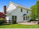 Backyard featuring lush grass, brick patio with stone fire pit, and back of home at 3002 Fair Meadows Dr, Monroe, NC 28110