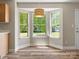 Cozy breakfast nook area featuring large windows and wood-look flooring at 3002 Fair Meadows Dr, Monroe, NC 28110