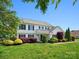Charming two-story home with a well-maintained lawn, colorful shrubbery, and classic shutters at 3002 Fair Meadows Dr, Monroe, NC 28110