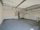 Spacious garage with high ceilings and painted floors providing ample space for parking and storage at 3002 Fair Meadows Dr, Monroe, NC 28110