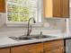 A modern kitchen sink boasts updated fixtures and countertops at 3002 Fair Meadows Dr, Monroe, NC 28110