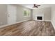 Bright living room with hardwood floors, a fireplace, and a ceiling fan at 3002 Fair Meadows Dr, Monroe, NC 28110