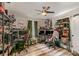 Spacious home office setup with multiple workstations, shelving, and natural light from two windows at 303 S Iredell Ave, Spencer, NC 28159