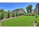 A serene backyard with green lawn, privacy fence and lush landscaping at 3473 Willow Oak Rd, Charlotte, NC 28209