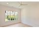 Bedroom featuring a large window with a view of the backyard at 3473 Willow Oak Rd, Charlotte, NC 28209