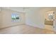 Bright bedroom with hardwood floors, a ceiling fan, and an ensuite bathroom at 3473 Willow Oak Rd, Charlotte, NC 28209