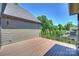 A spacious wood deck with black metal railings offers serene outdoor living at 3473 Willow Oak Rd, Charlotte, NC 28209
