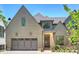 Charming home with a two car garage, brick accents, and a well manicured lawn at 3473 Willow Oak Rd, Charlotte, NC 28209