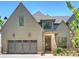 Charming home with a two-car garage, brick accents, and a welcoming front door with address numbers at 3473 Willow Oak Rd, Charlotte, NC 28209