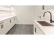 Well-lit laundry room featuring modern cabinets, countertops, and sleek fixtures at 3473 Willow Oak Rd, Charlotte, NC 28209