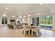 Spacious living room with recessed lighting, expansive windows and access to the backyard at 3473 Willow Oak Rd, Charlotte, NC 28209