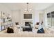 Comfortable living room with fireplace, TV, modern lighting, and stylish furnishings at 3473 Willow Oak Rd, Charlotte, NC 28209