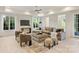 Comfortable living room with large sectional sofa and views of the outdoors through large windows at 3473 Willow Oak Rd, Charlotte, NC 28209