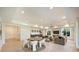Open-concept living room with recessed lighting, wet bar and comfortable seating area at 3473 Willow Oak Rd, Charlotte, NC 28209