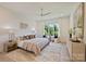 Bright bedroom with large window, neutral tones, soft rug, and stylish furnishings at 3473 Willow Oak Rd, Charlotte, NC 28209