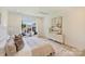 Bright, well-lit bedroom with a large window view, creating a serene and inviting space at 3473 Willow Oak Rd, Charlotte, NC 28209