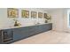 Wet bar featuring marble countertops, dark gray cabinetry and a wine refrigerator at 3473 Willow Oak Rd, Charlotte, NC 28209