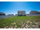 Spacious backyard featuring a white fence, offering privacy and space for outdoor activities at 3637 Allenby Pl, Monroe, NC 28110