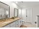 Bathroom features a double sink vanity with granite counters, white cabinets, tile floors, and modern fixtures at 3637 Allenby Pl, Monroe, NC 28110